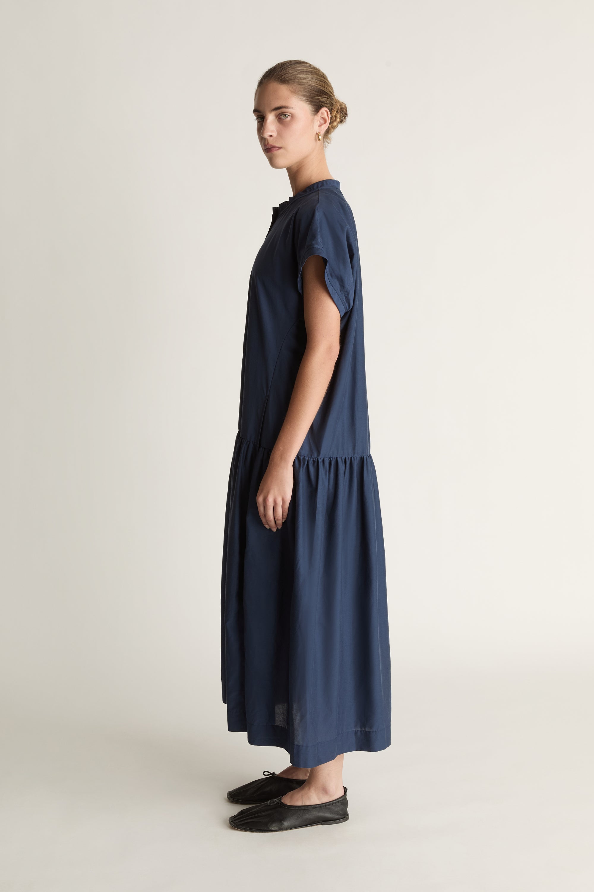 Woman wearing a blue dress on a white background