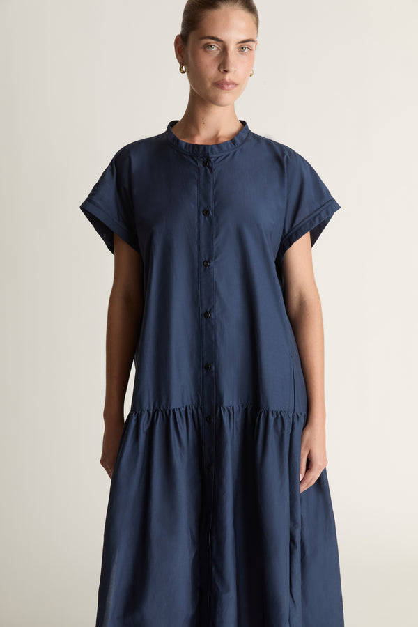 Woman wearing a blue dress on a white background