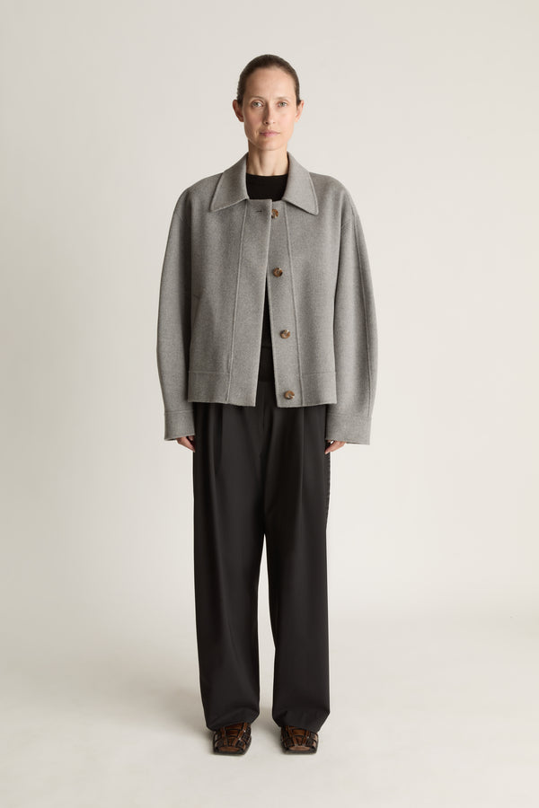 Woman Wearing a Grey Jacket with Black trousers