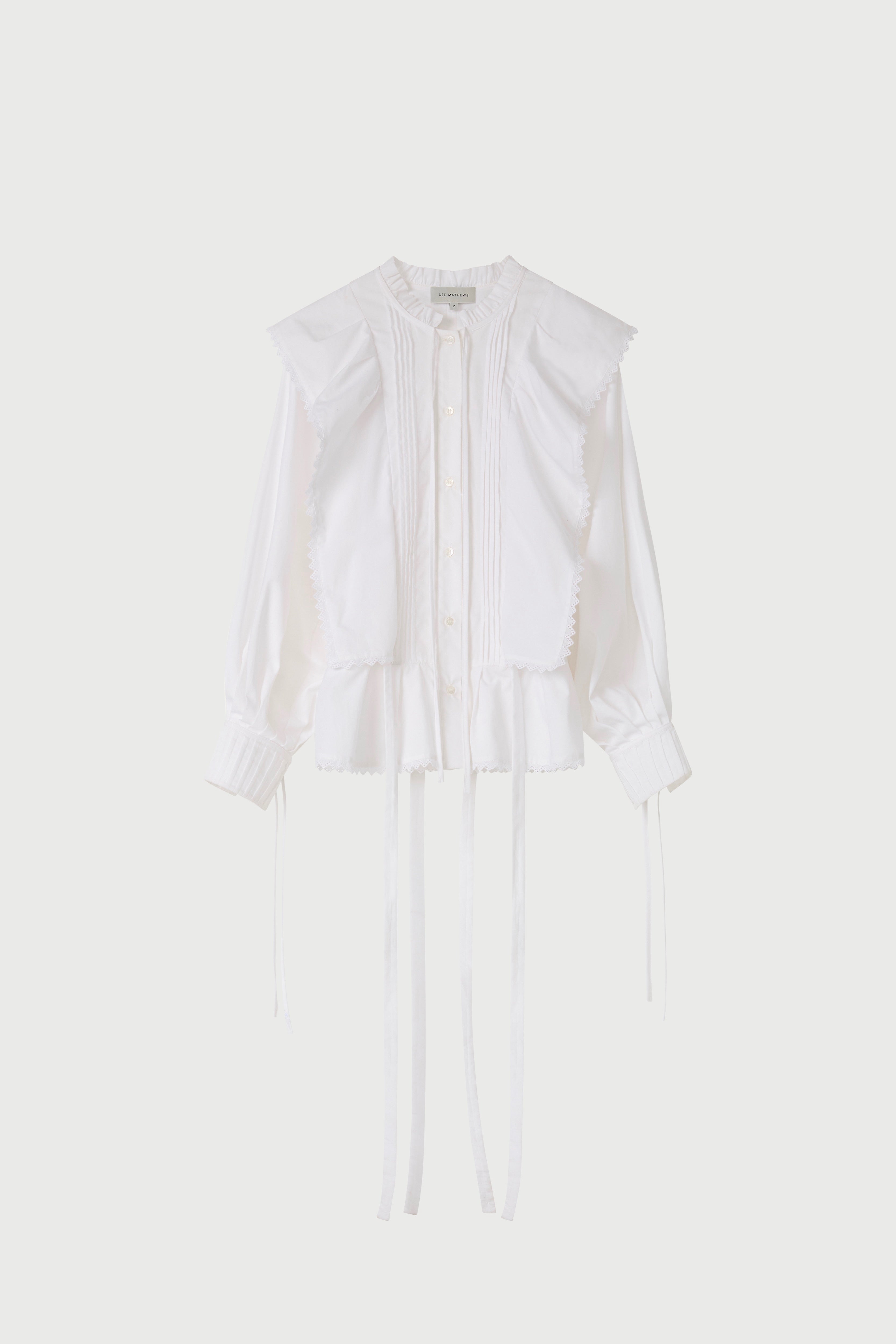 White blouse on a light beige background